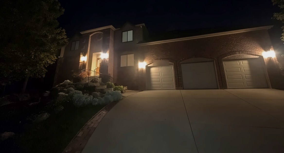 Exterior lantern lighting across the front of a brick home in Colorado Springs